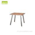 Table basse en teck arrondi avec chaise de loisirs en teck